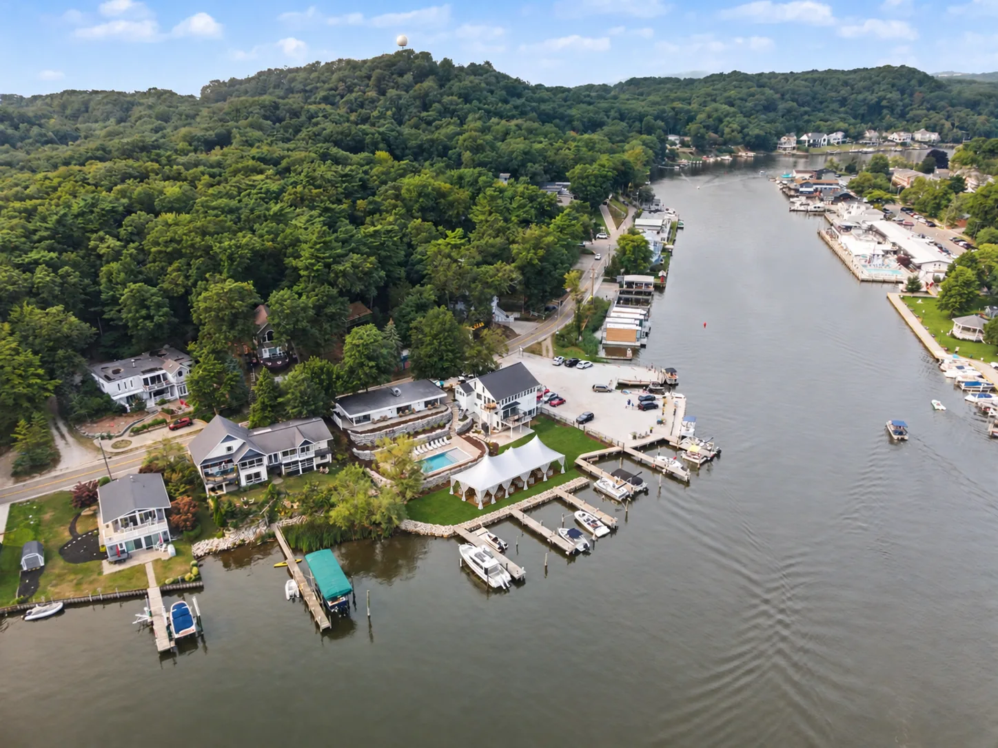 Aerial view of Casa Loma's wedding tent, pool and boat slips on the Kalamazoo River